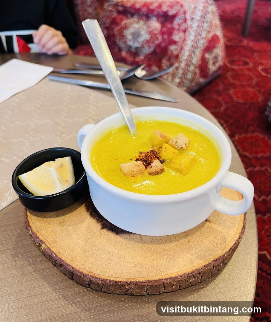 Soup with Croutons and Lemon Wedge