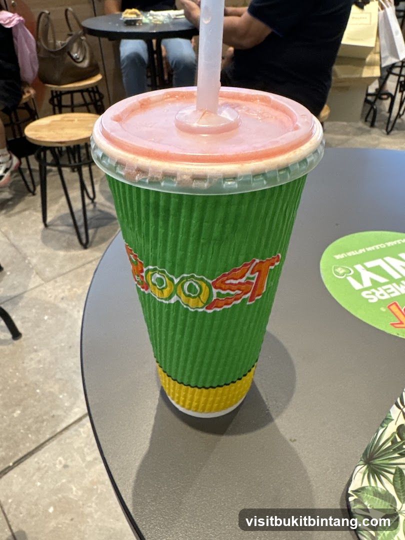 Green cup with a straw