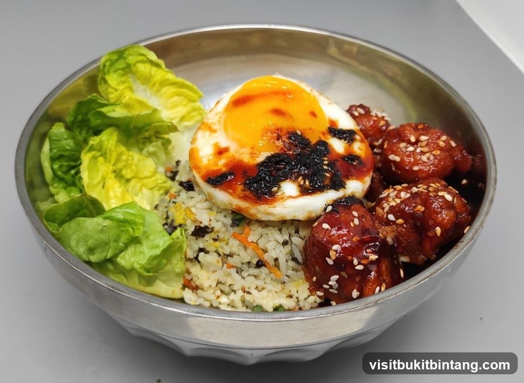 Fried Egg and Chicken Rice Bowl