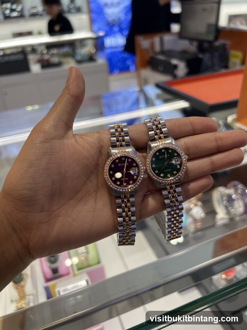 Two watches held in a hand