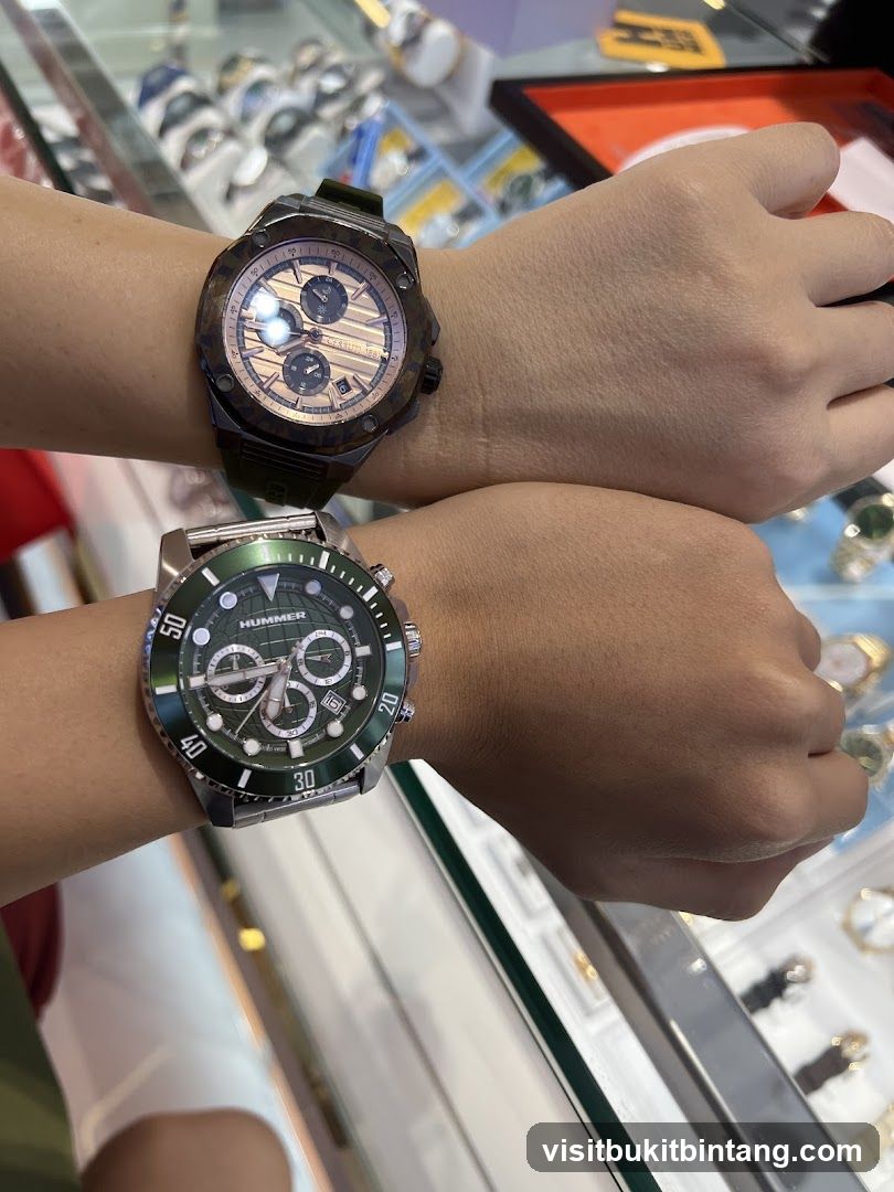 Two watches on wrists