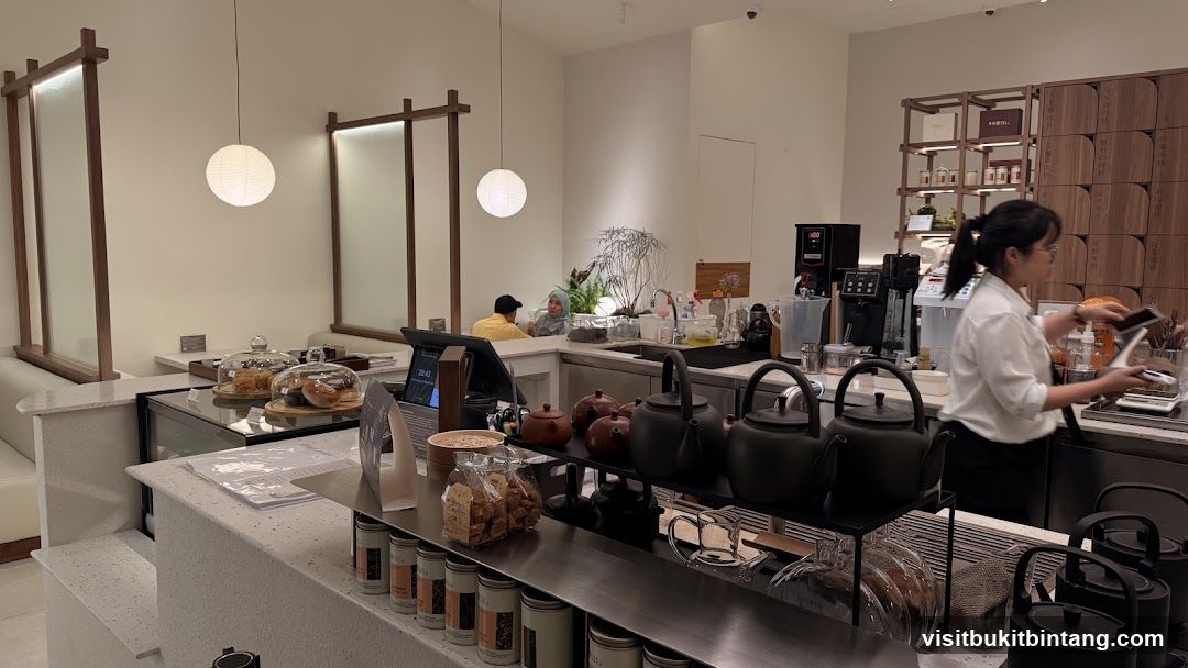 Cafe Interior with Staff and Teapots