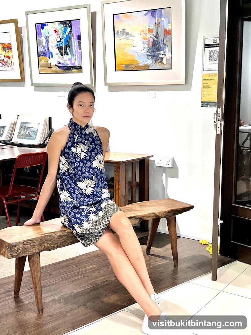 Woman in a blue dress sitting on a wooden bench in an art gallery