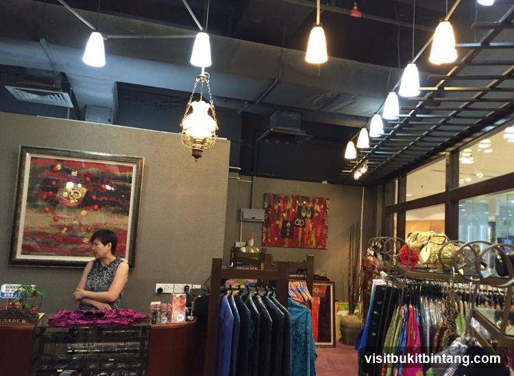 Clothing store interior with artwork and clothing racks