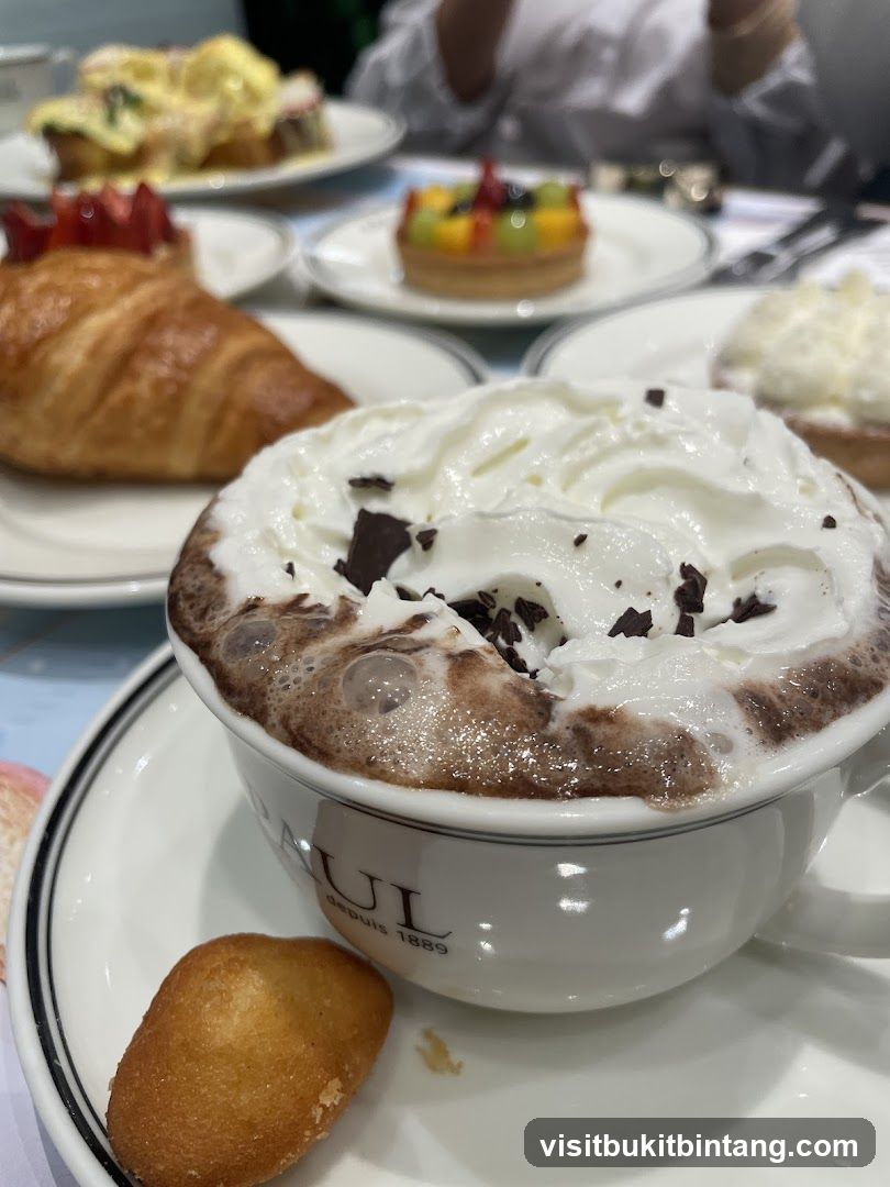 Hot Chocolate with Whipped Cream and Pastries