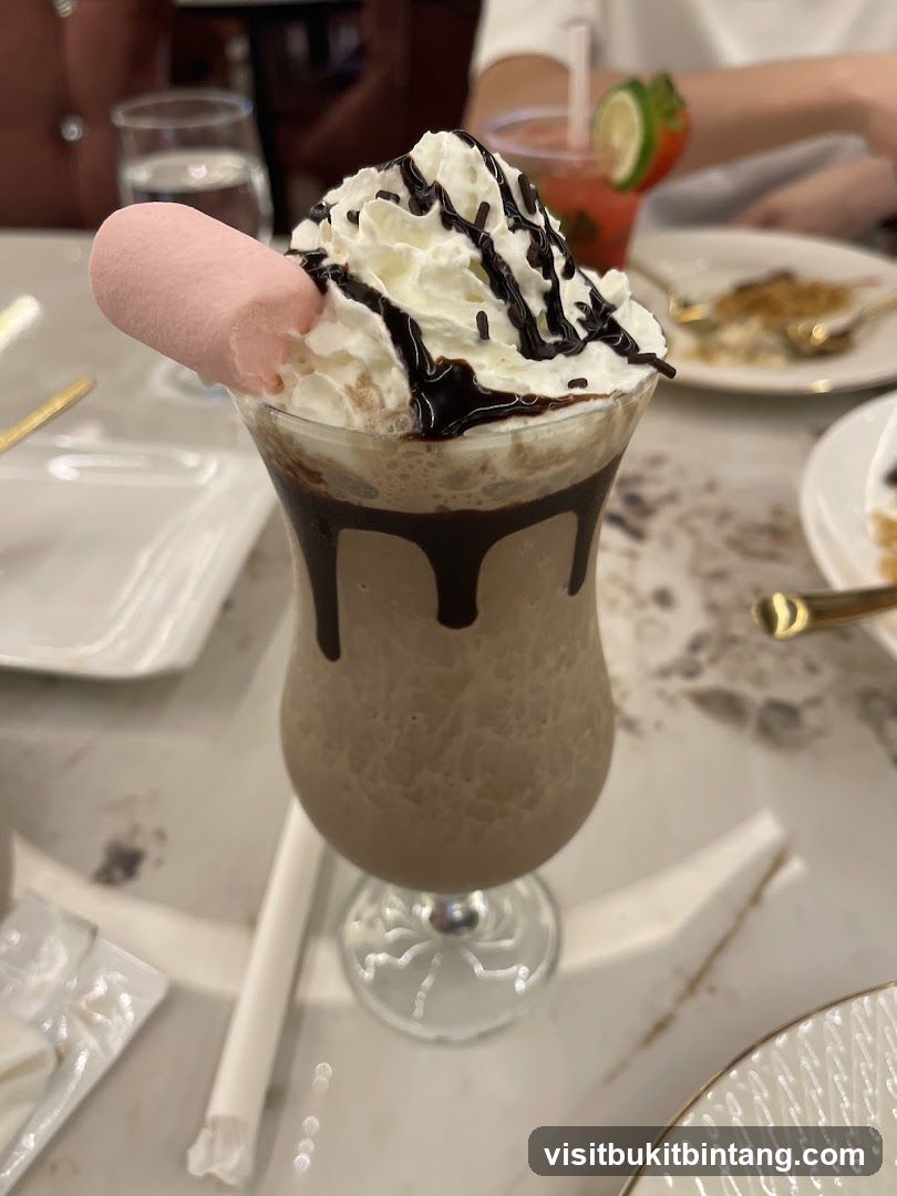 Chocolate milkshake with whipped cream and marshmallow