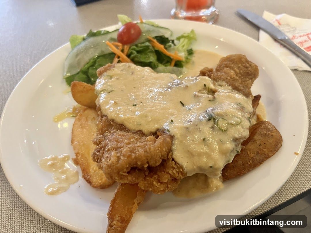 Fried Chicken with Potatoes and Salad