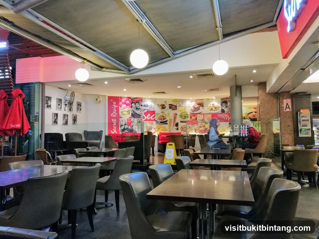 Interior of a cafe with seating and food displays