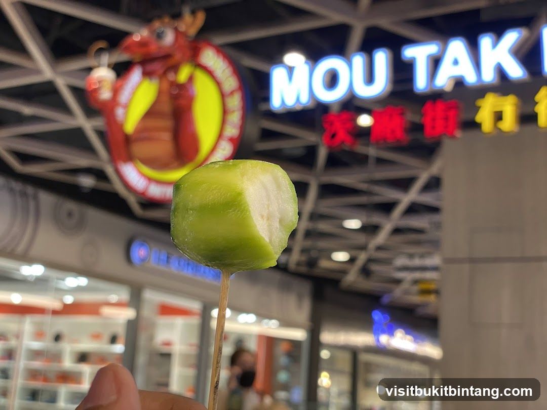 Fruit on a Stick with Storefront in Background