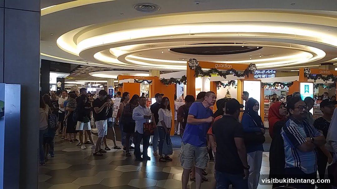 People queuing in a mall