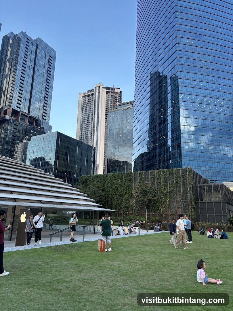 People in a park with modern buildings