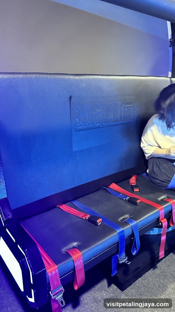 Interior seating area with safety straps
