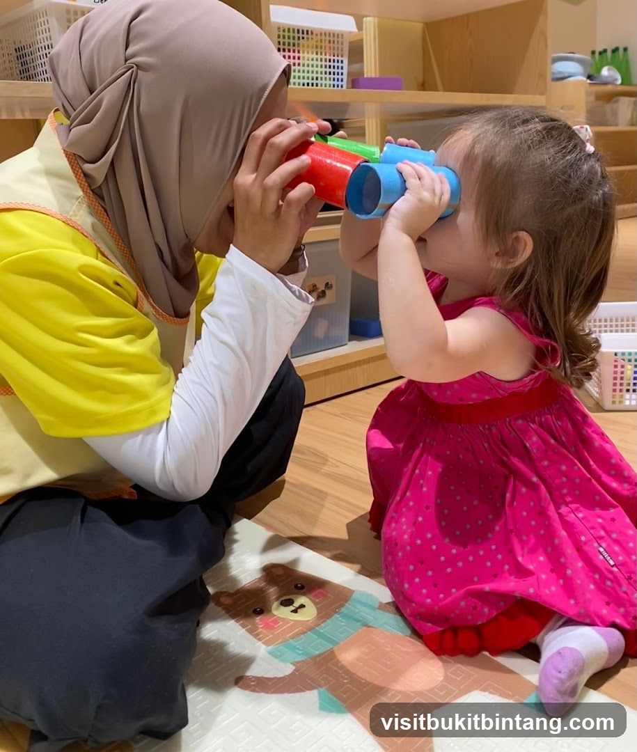 Teacher and child looking through toy binoculars