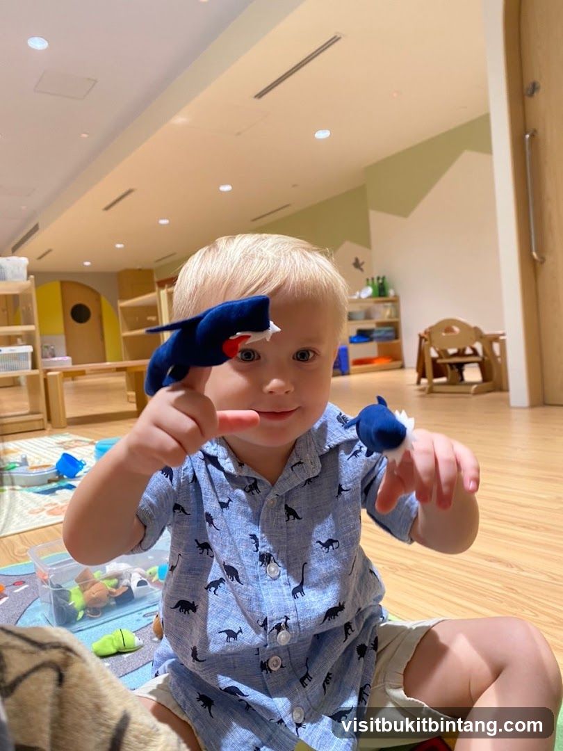 Child playing with finger puppets