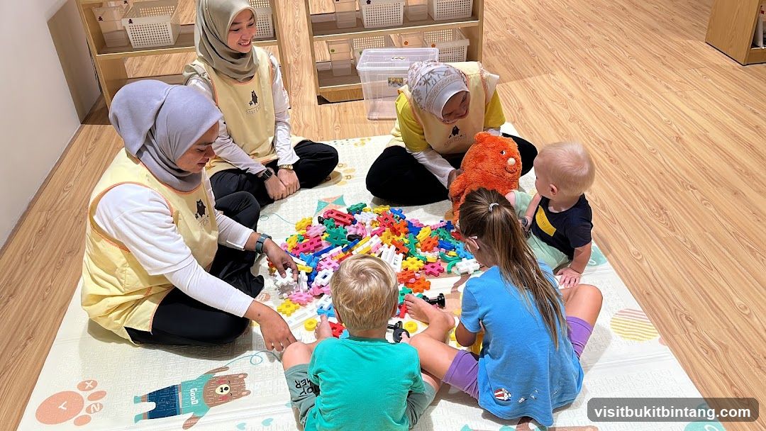 Children and teachers playing with blocks