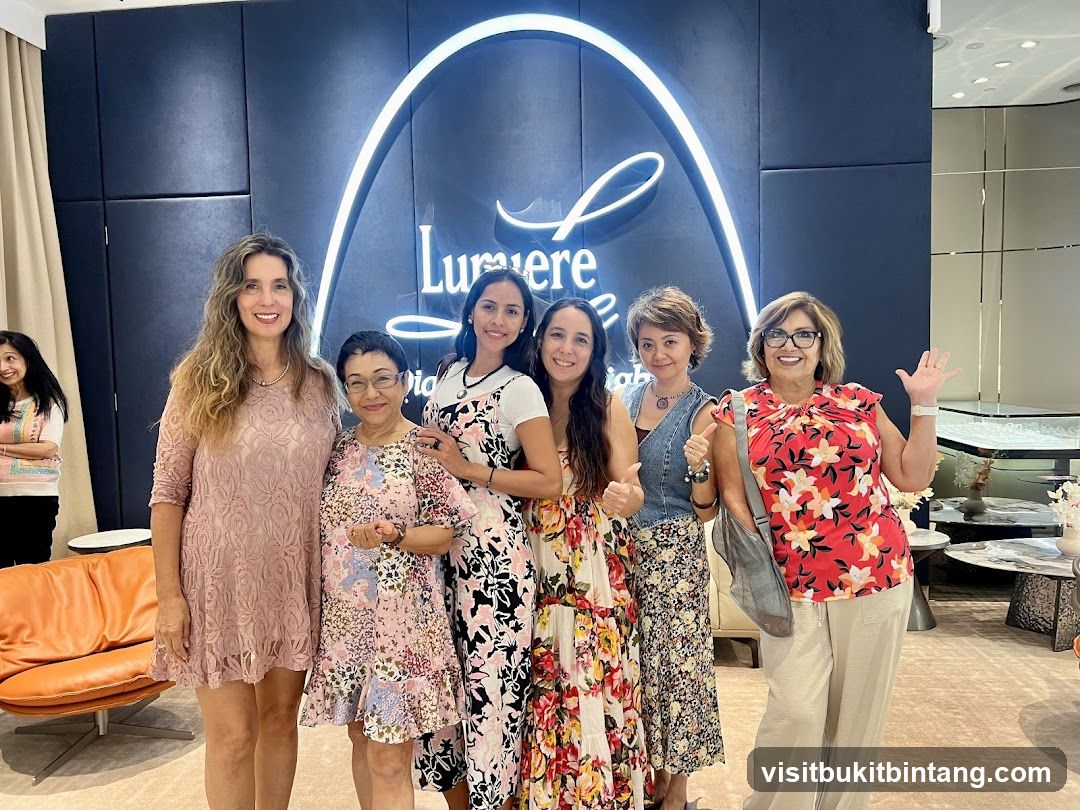 Group of women posing in front of a store logo