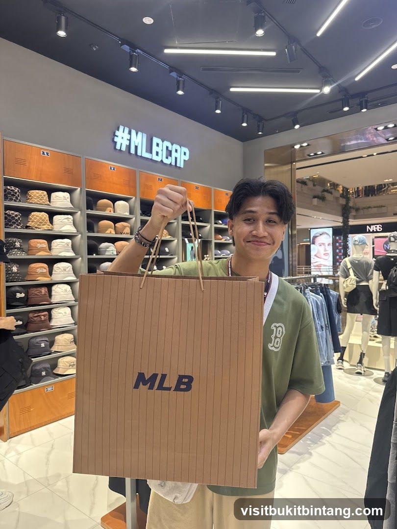 Man holding an MLB shopping bag in a store