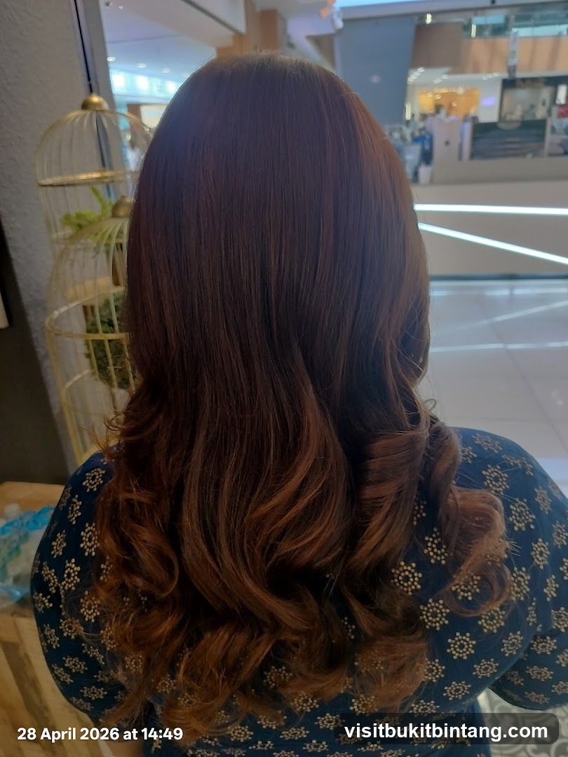 Woman with styled brown hair