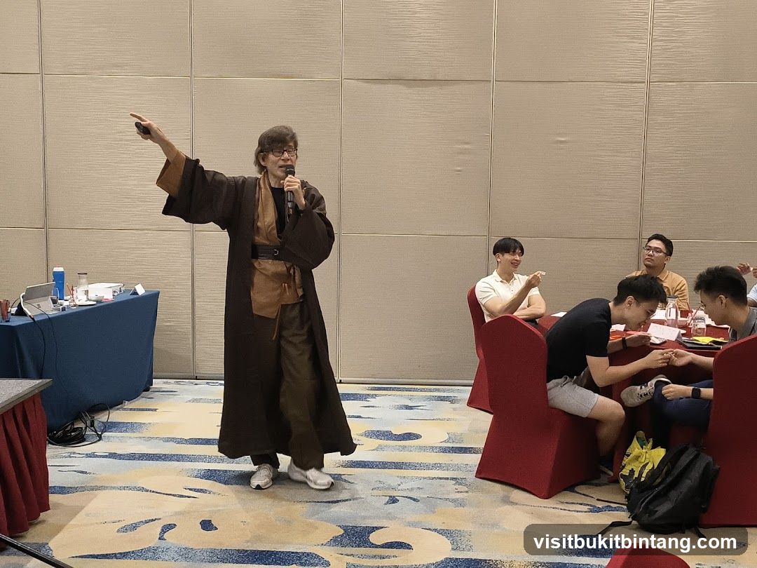 Speaker in costume addressing an audience