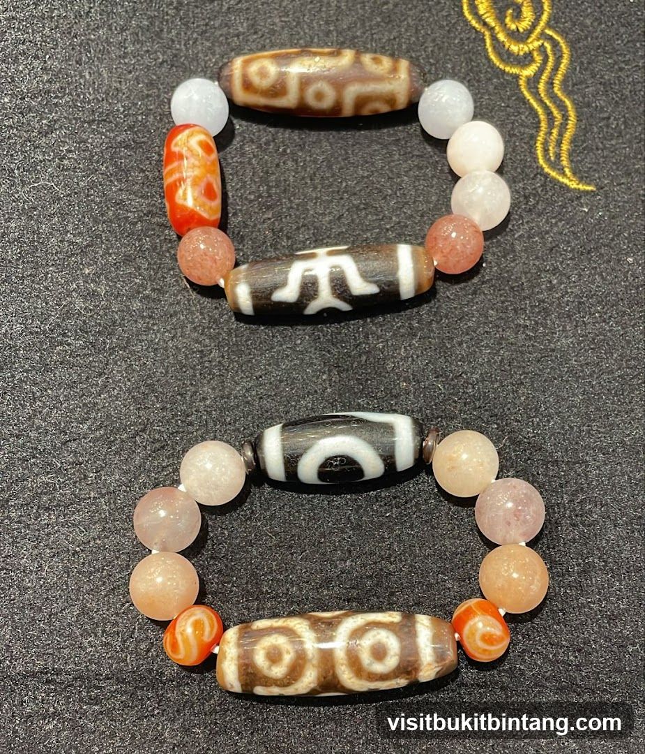 Two bracelets with dzi beads
