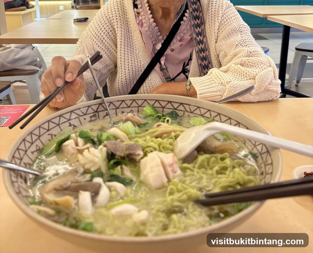 Person eating noodles