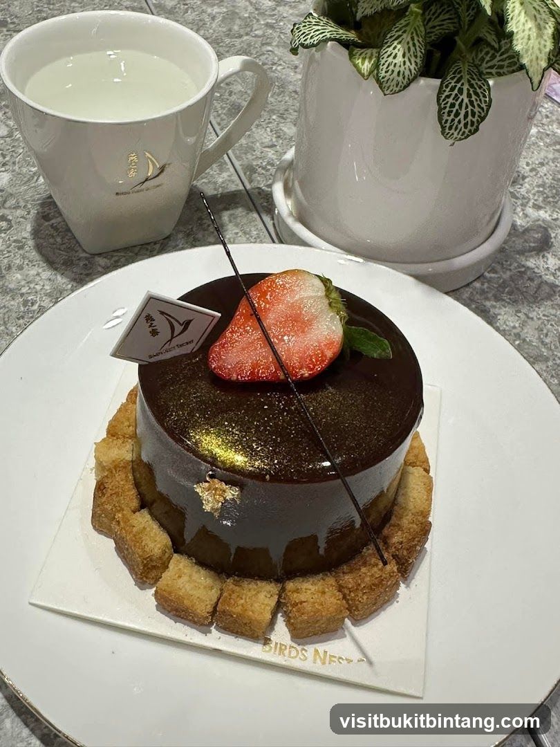 Chocolate cake with strawberry and a drink