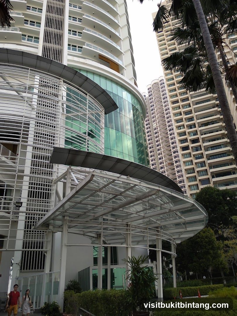 Modern Building Entrance with Palm Trees