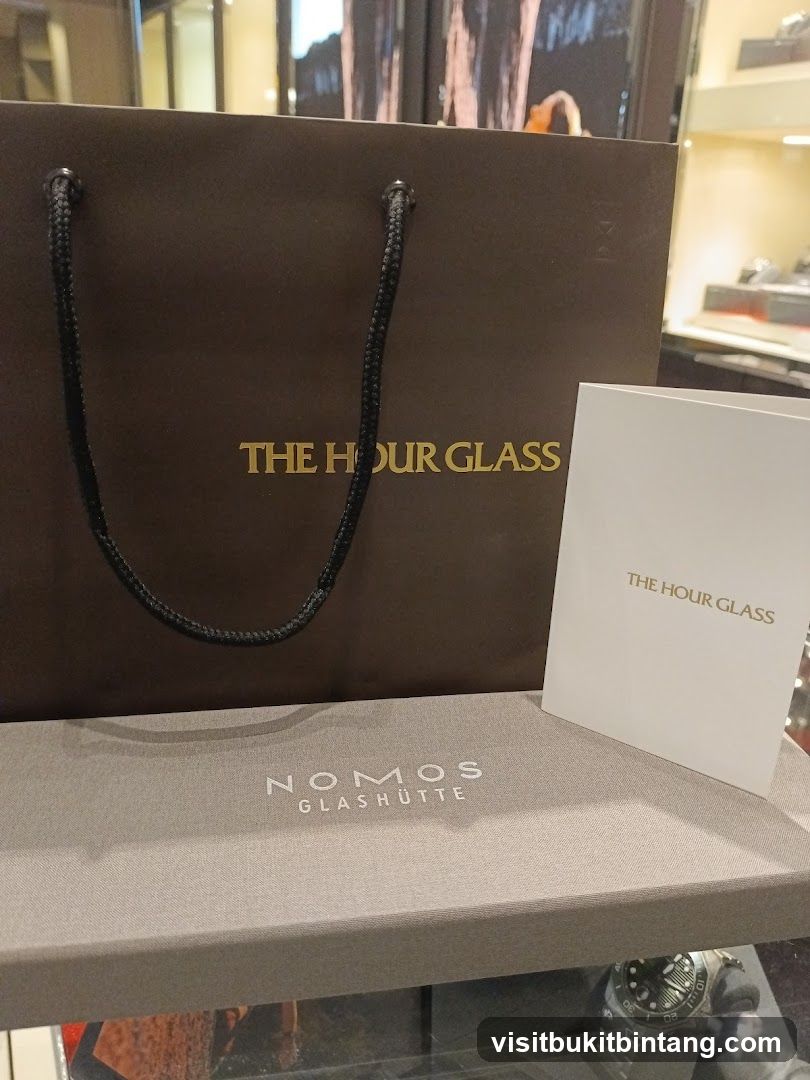 The Hour Glass and Nomos Glashütte branded items