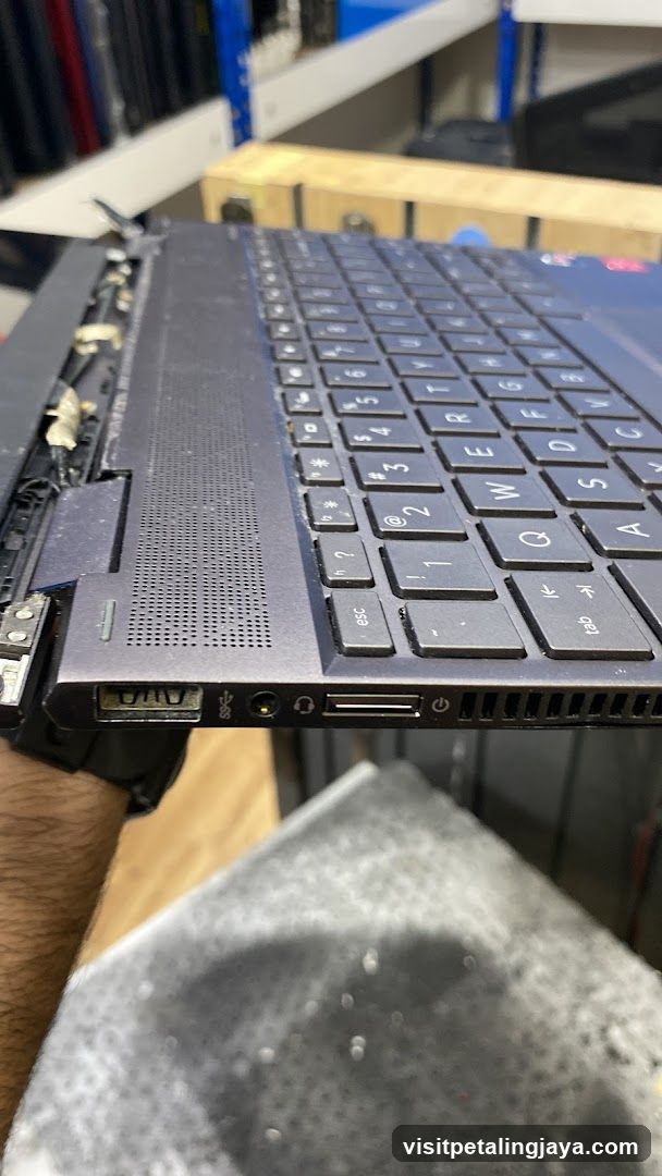 Disassembled Laptop in Workshop