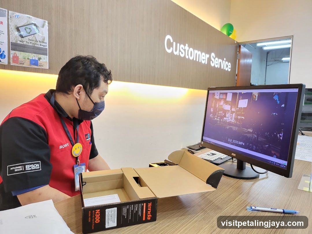 Customer Service Desk with Staff and Electronics Packaging