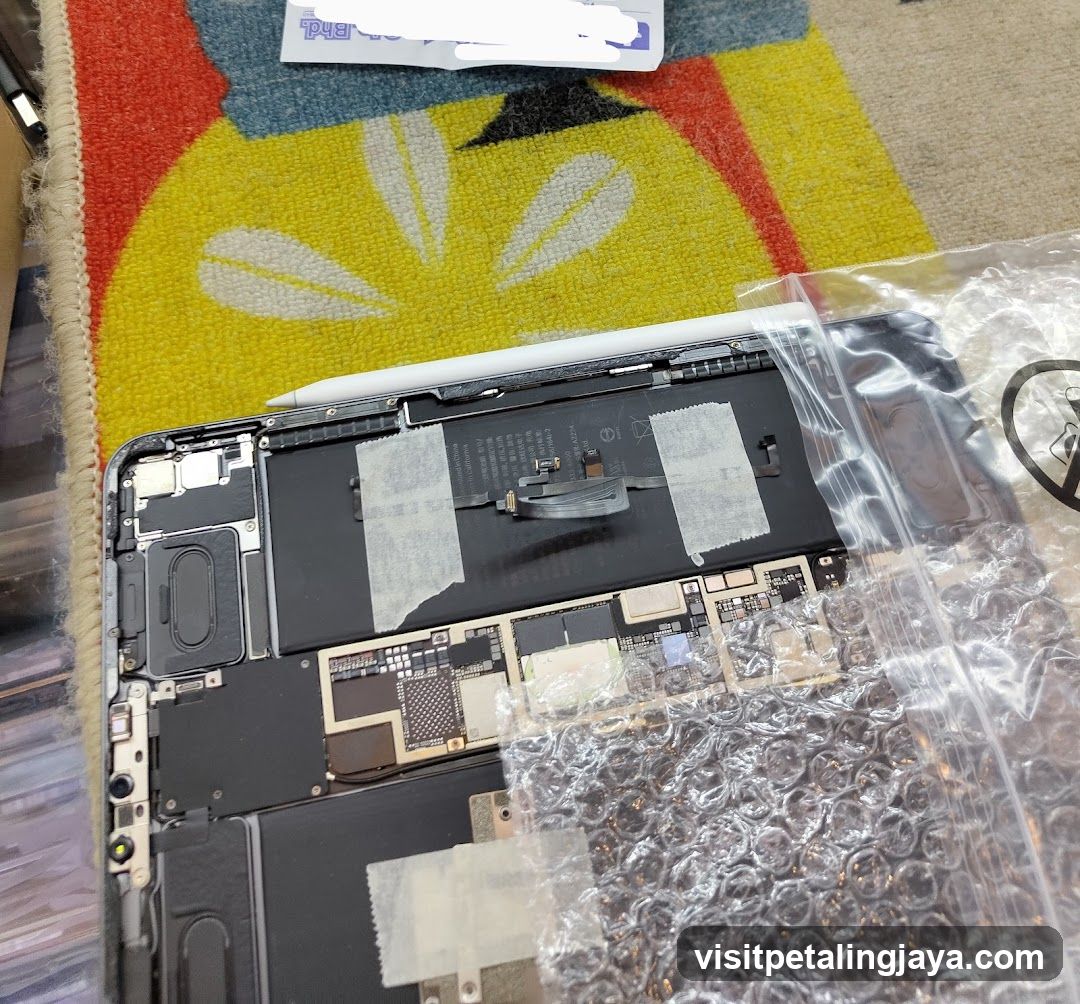 Disassembled Laptop on Carpet