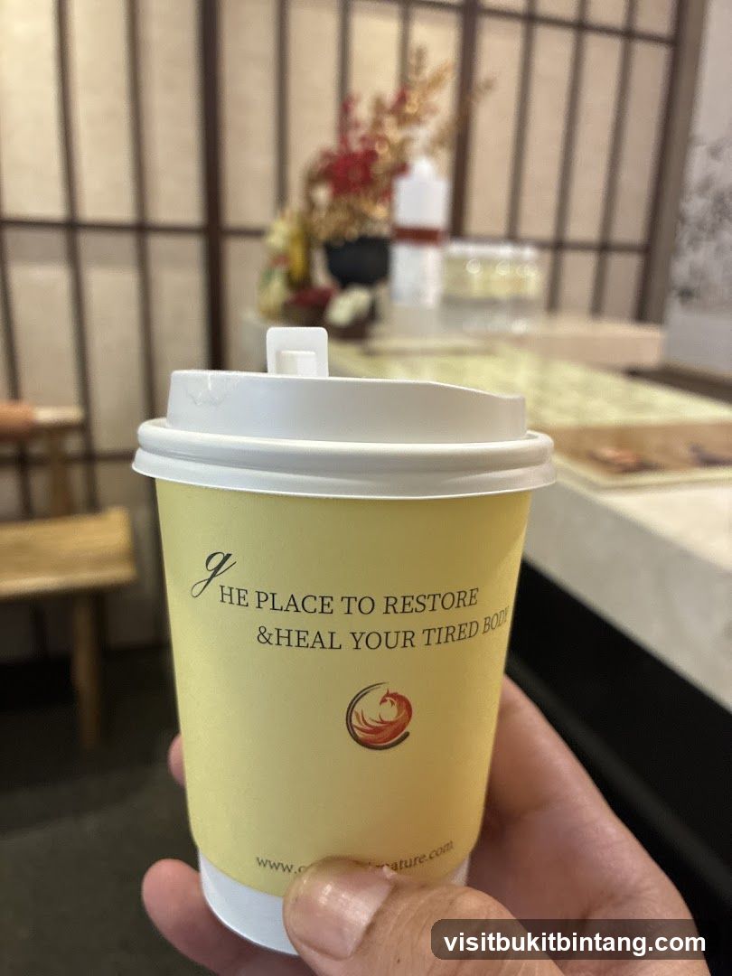 Paper cup with text and logo