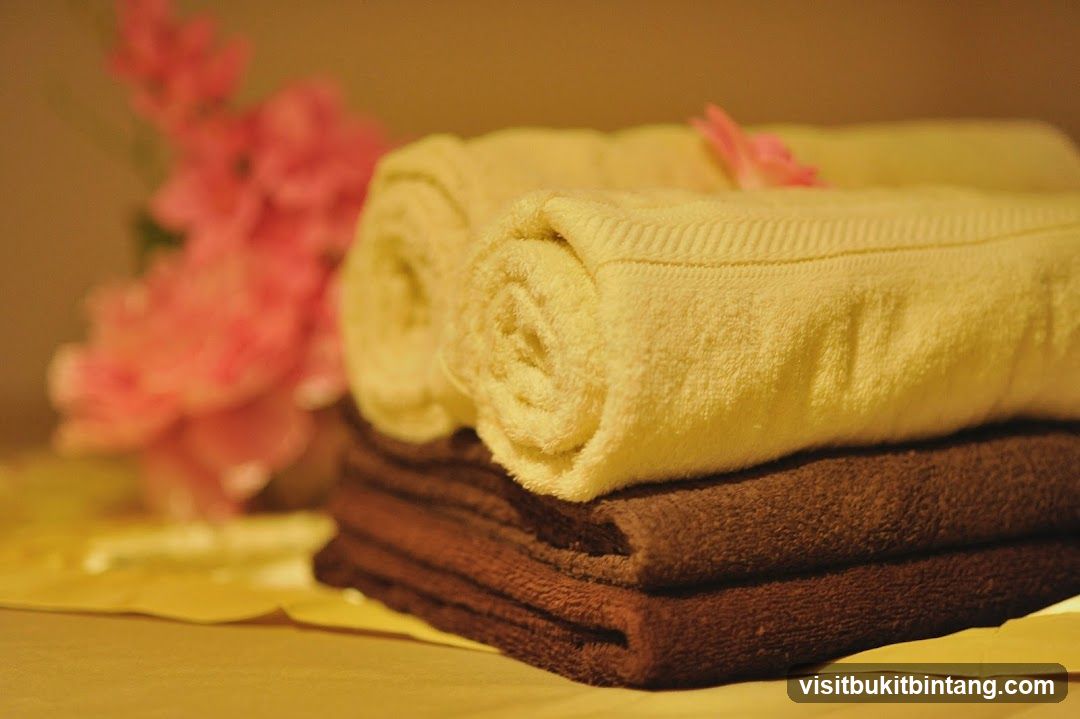 Rolled and Folded Towels with Flowers