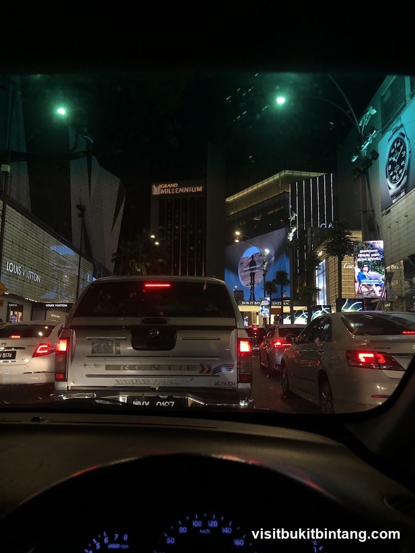 Nighttime traffic with illuminated buildings