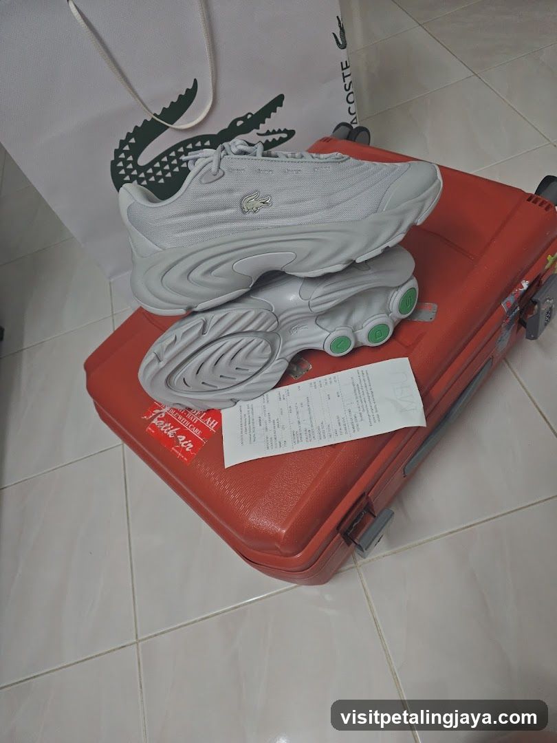 Lacoste Sneakers on Suitcase