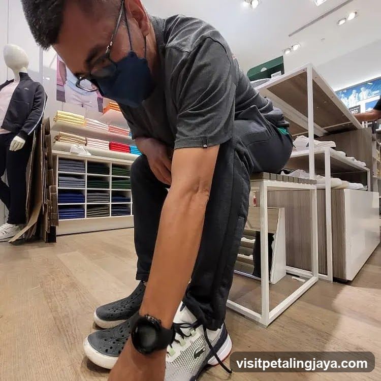 Man Trying on Shoes in Store