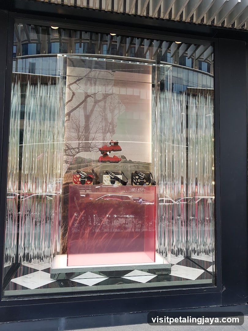 Window Display with Red Objects and Reflections