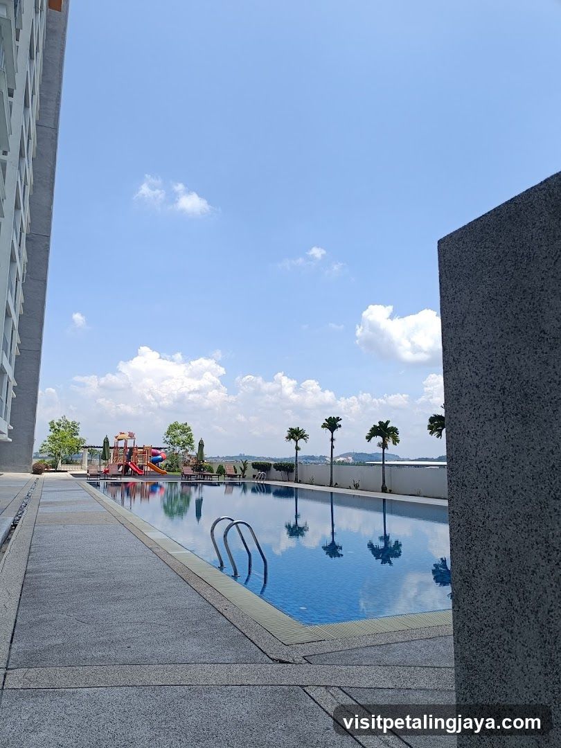Outdoor Pool Area with Skyline View