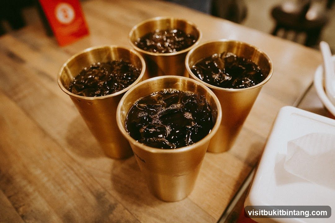 Four Golden Cups of Iced Beverage