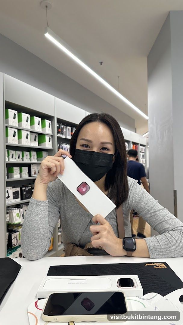 Woman holding a box with a watch