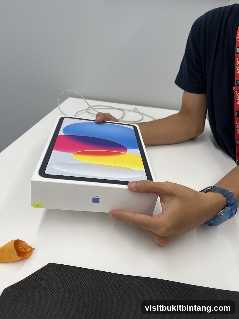 Person holding an iPad box