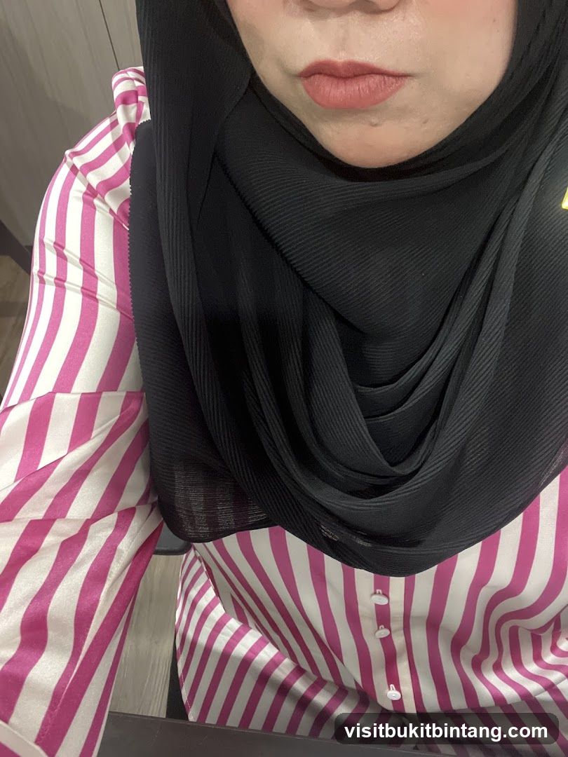 Woman in Hijab and Striped Blouse
