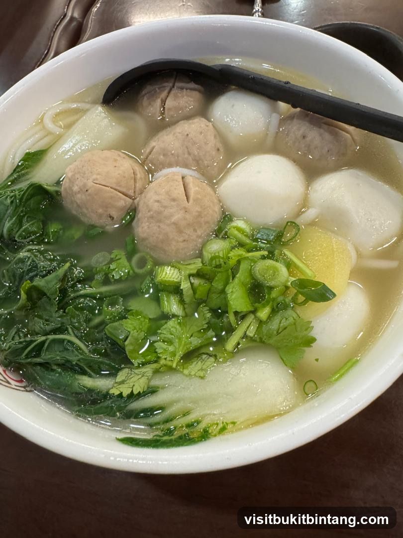 Noodle Soup with Meatballs and Greens