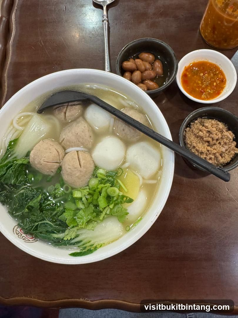 Noodle Soup with Meatballs and Greens