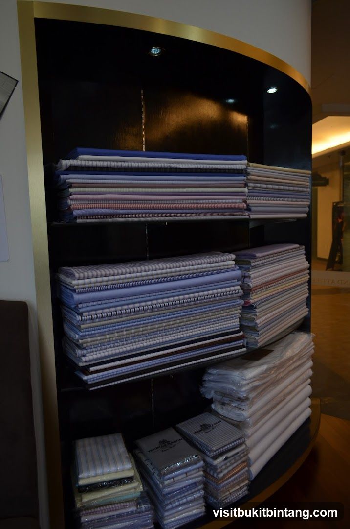 Stacks of folded fabric on shelves