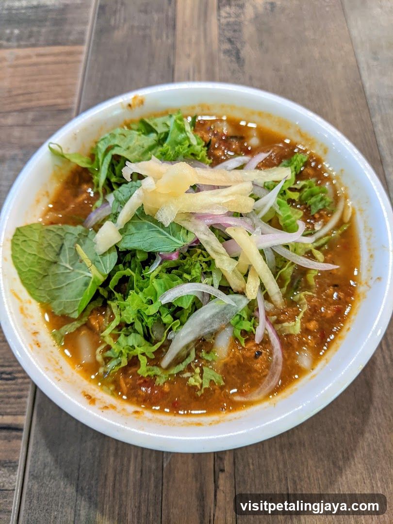 Bowl of Soup with Greens and Onions