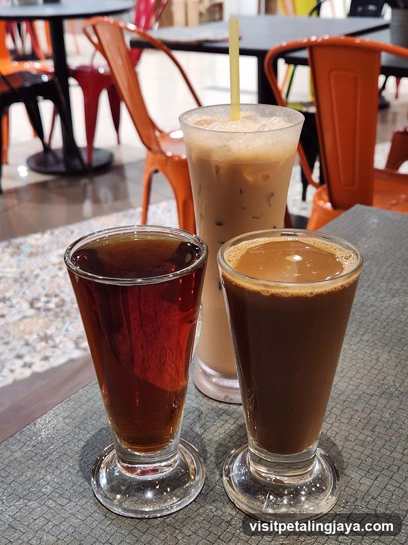 Three glasses of coffee drinks on a table