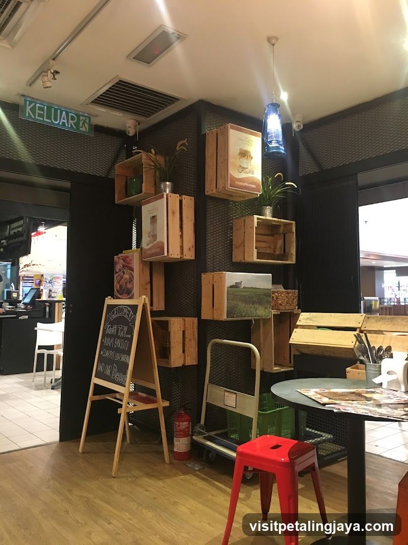 Interior of a cafe or restaurant with wooden crates and chalkboard menu