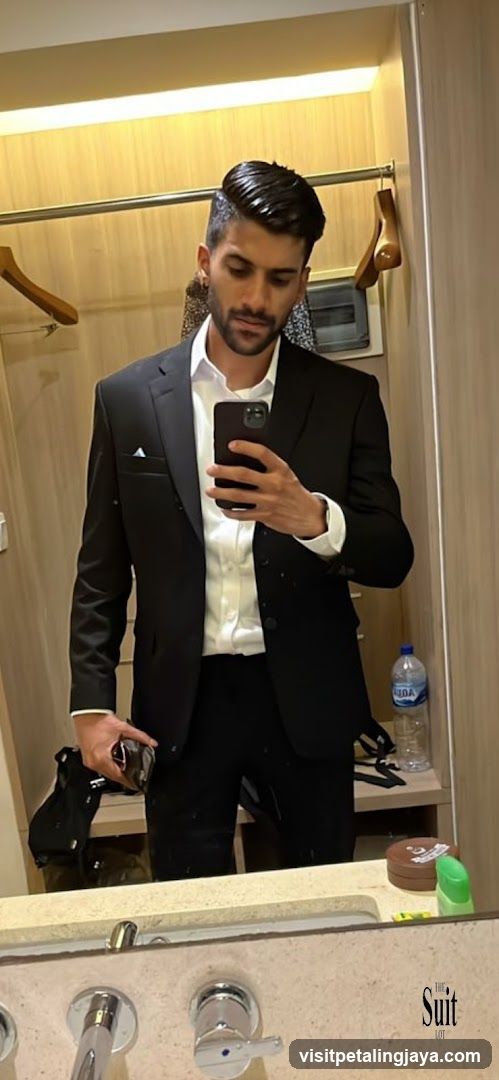 Man in Suit Taking Mirror Selfie