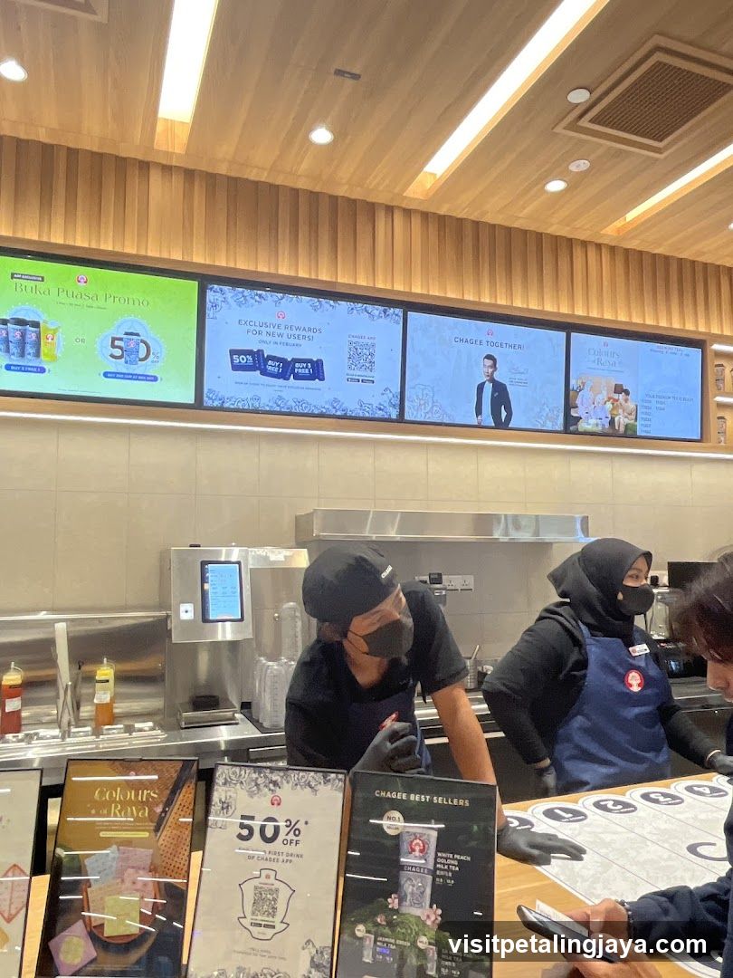 Coffee Shop Interior with Staff and Promotional Displays